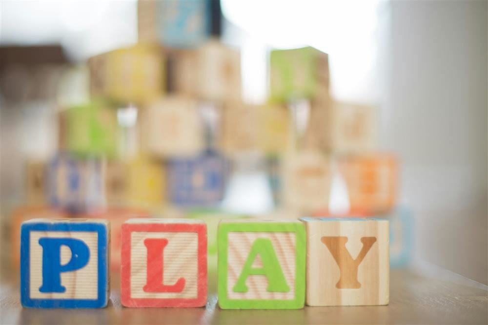 blocks that spell out the word play 